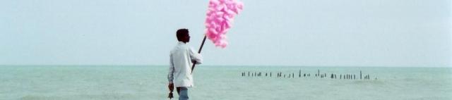 Man selling candy-floss on the beach, Pondicherry, India, 2007.